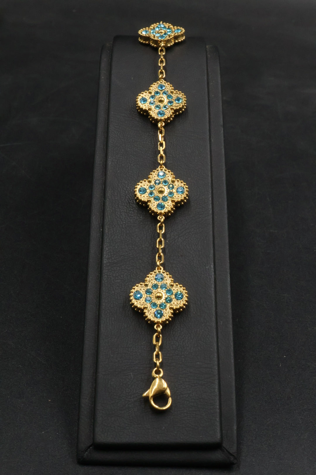 Pulsera Trébol Dorado - Zirconias Celeste.